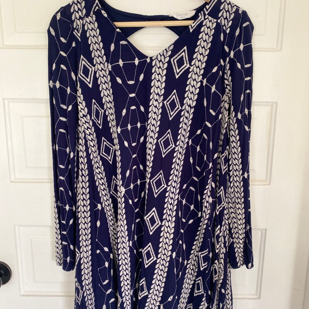 Long sleeve dress, above the knee.